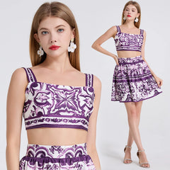 Woman wearing a purple and white patterned outfit on a white background