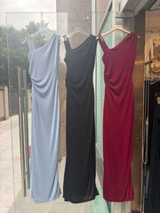 Three one-shoulder ruched maxi dresses in blue, black, and red