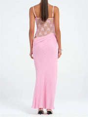Pink dress with sheer overlay on a white background