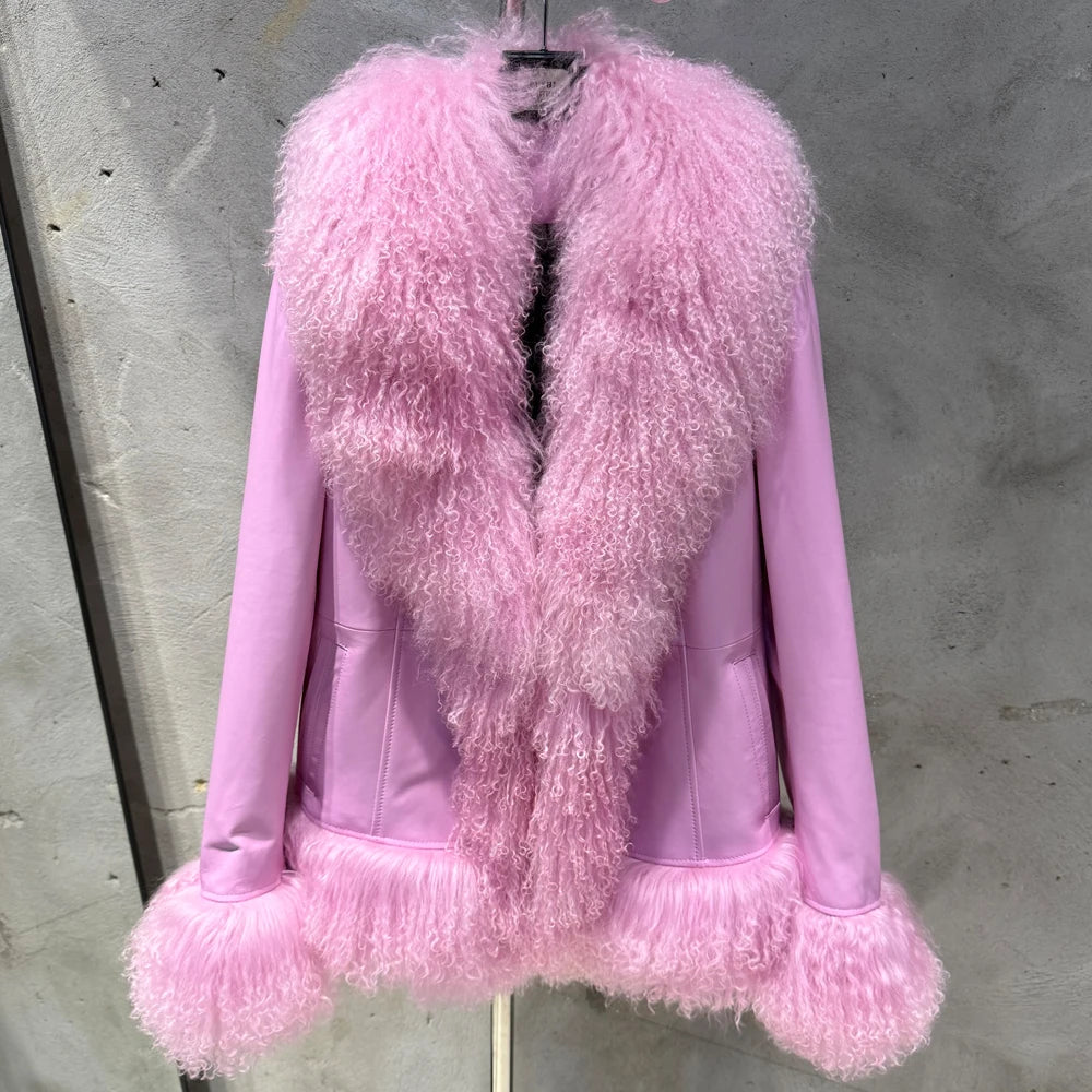 Pink fur coat on a hanger against a gray background