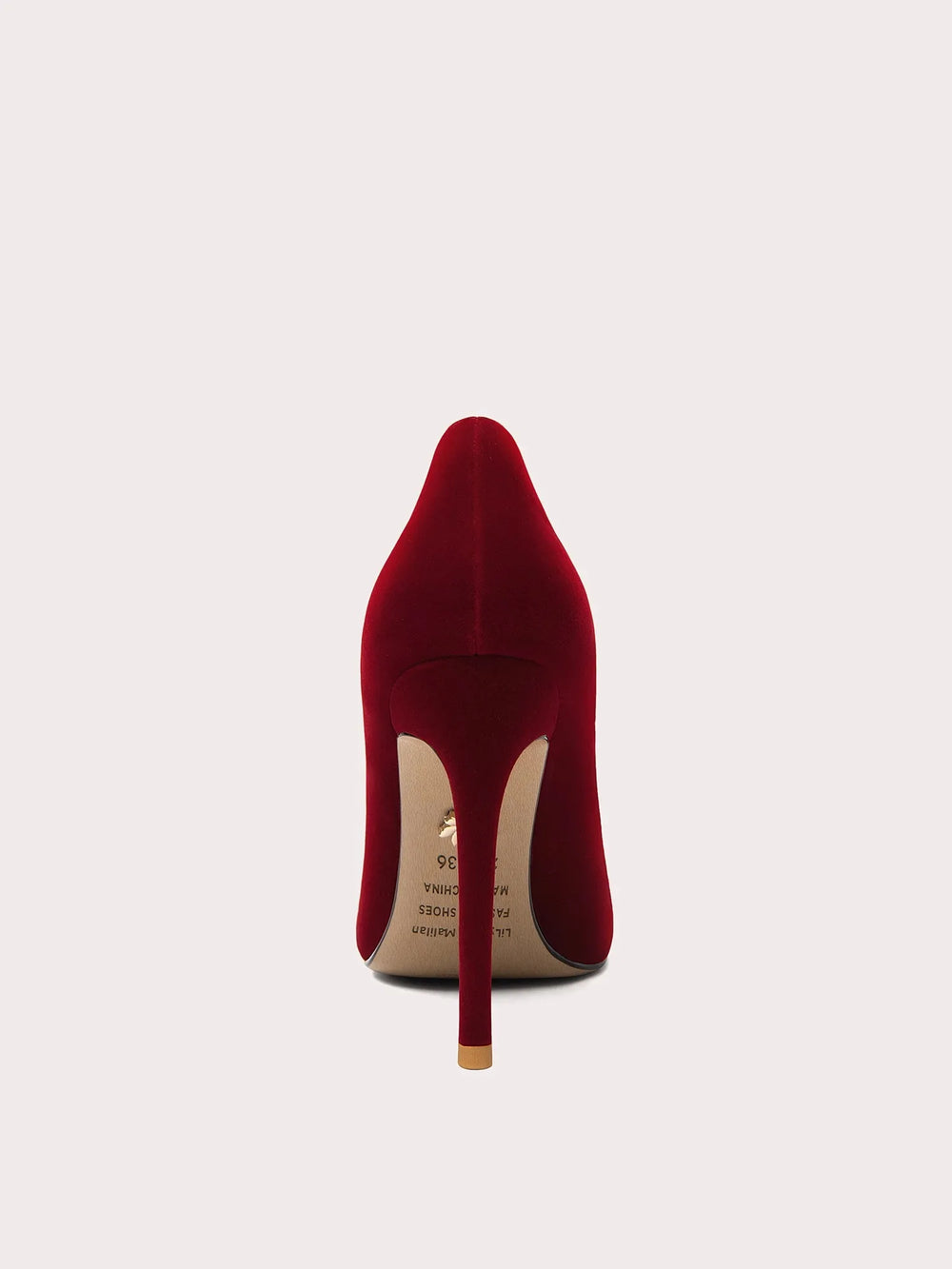 Red high-heeled shoe on a white background