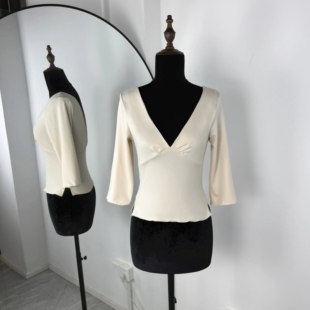 White blouse on a mannequin against a white background
