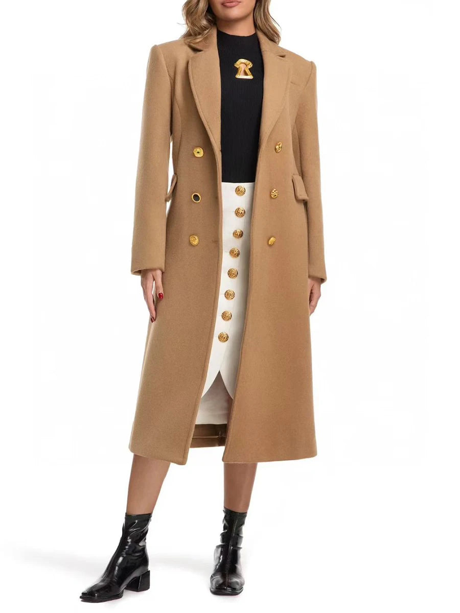Person wearing a long beige coat with gold buttons 