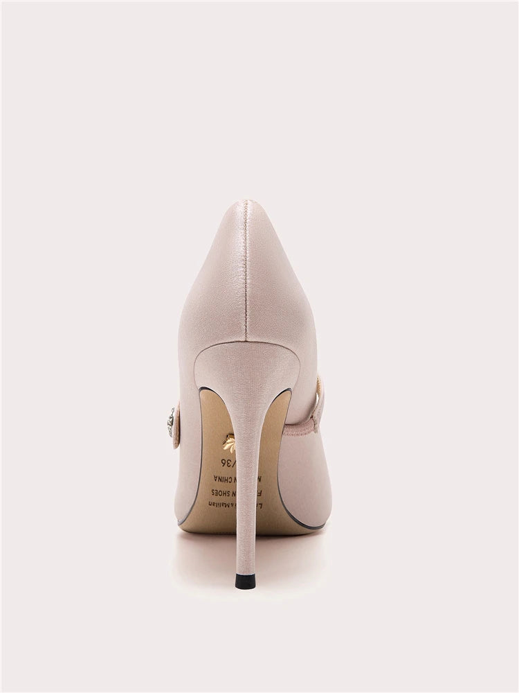 Beige high-heeled shoe on a white background