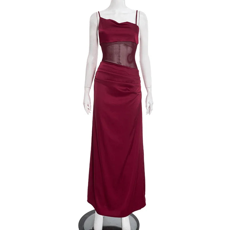 Maroon evening gown on a mannequin against a white background
