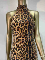 Leopard print dress on a mannequin against a plain background