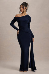 Navy blue off-shoulder gown with a slit on a beige background