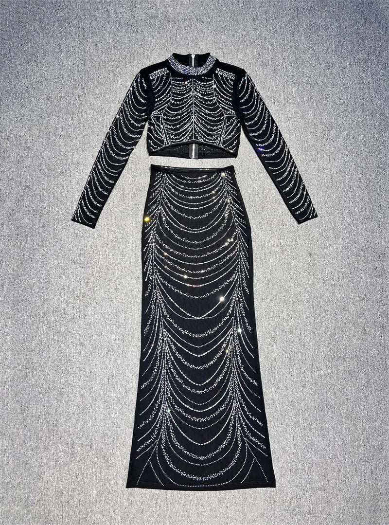 Black dress with silver embellishments on a gray background