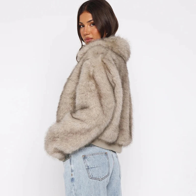 Woman wearing a fluffy beige jacket 