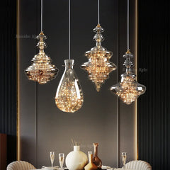 Lifestyle image showcasing the brass chandelier hanging above a bar, creating a sophisticated ambiance.Golden Atelier 2