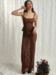 Woman wearing a brown lace dress against a textured white background with a potted plant.