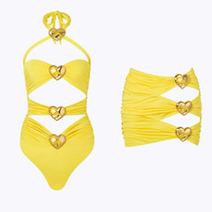 Flat lay of yellow embellished cut-out one-piece swimsuit and ruched skirt