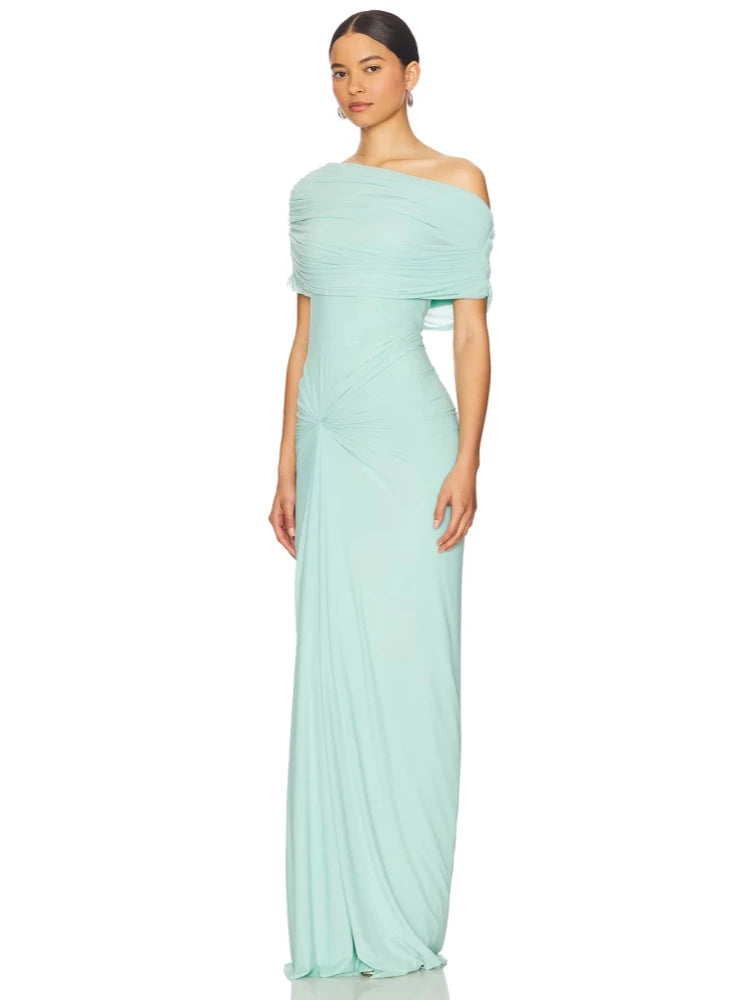 Woman wearing a light blue off-shoulder gown on a white background