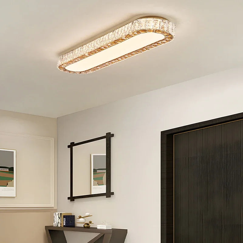 Modern ceiling light fixture in a room with a mirror and artwork on the wall.