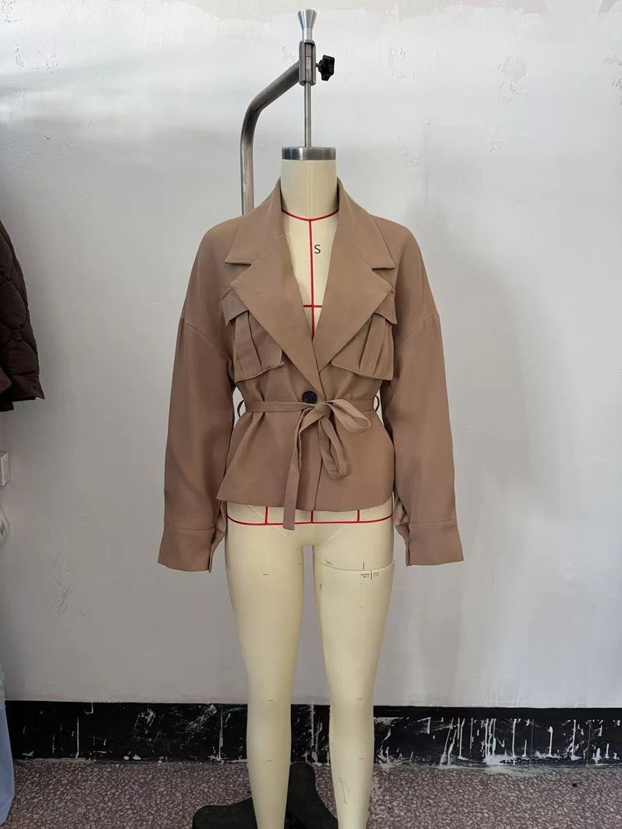 The beige trench coat on a mannequin 