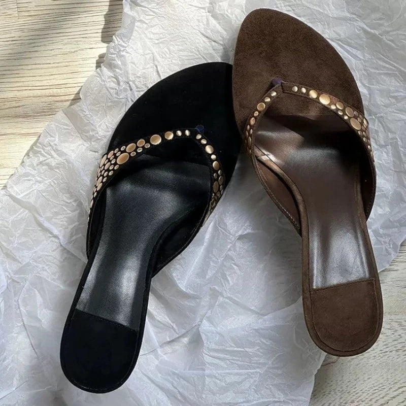 Pair of black and brown studded thong kitten heel sandals