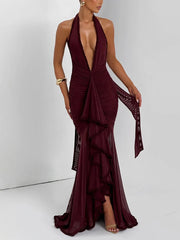 Burgundy evening gown with a deep neckline on a white background