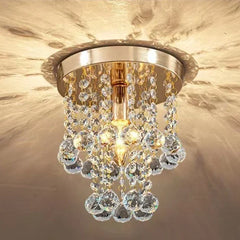 A sleek crystal ceiling lamp with a minimalist design, casting a warm glow in a modern bedroom. Golden Atelier 2