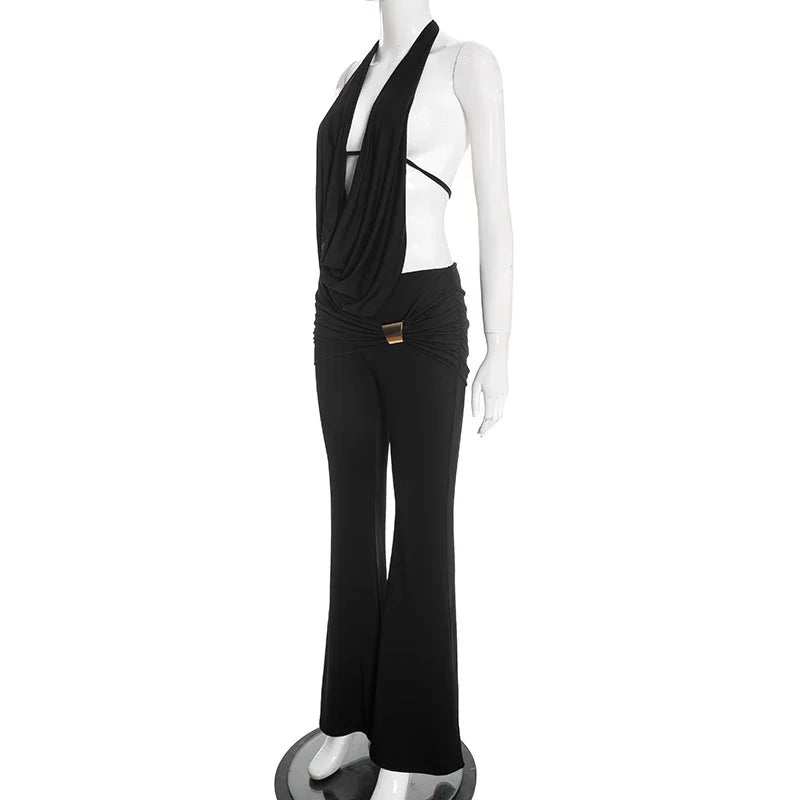 Mannequin wearing a black outfit with a draped top and wide-leg pants on a white background