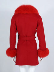 Red coat with fur trim on a white background