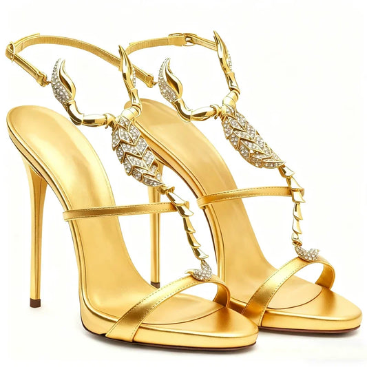 Gold stiletto heels with scorpion embellishments and crystal details