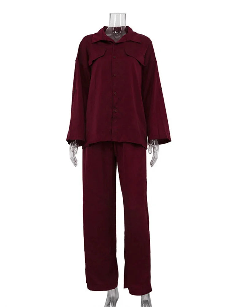 Maroon outfit on a mannequin against a white background