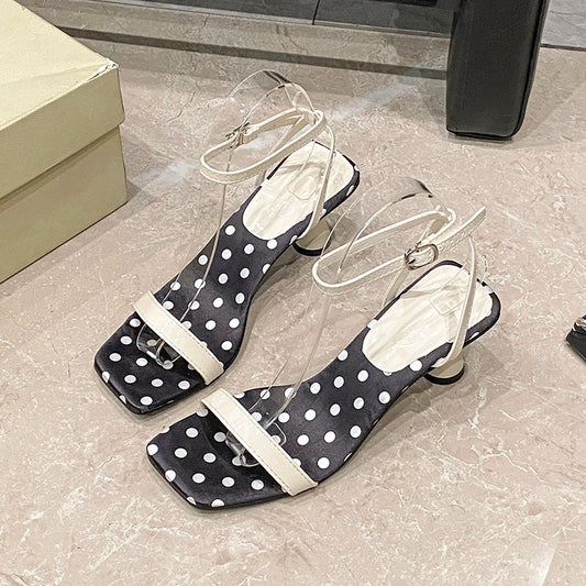 Close-up of polka dot ankle strap heel design