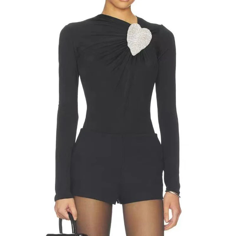 Black asymmetrical long-sleeve bodysuit with heart rhinestone