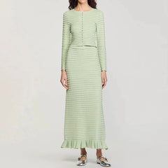 Light green knit cardigan and midi skirt set worn by a model.