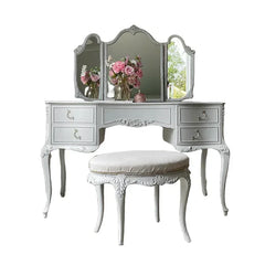 White vanity table with three mirrors and a matching stool 