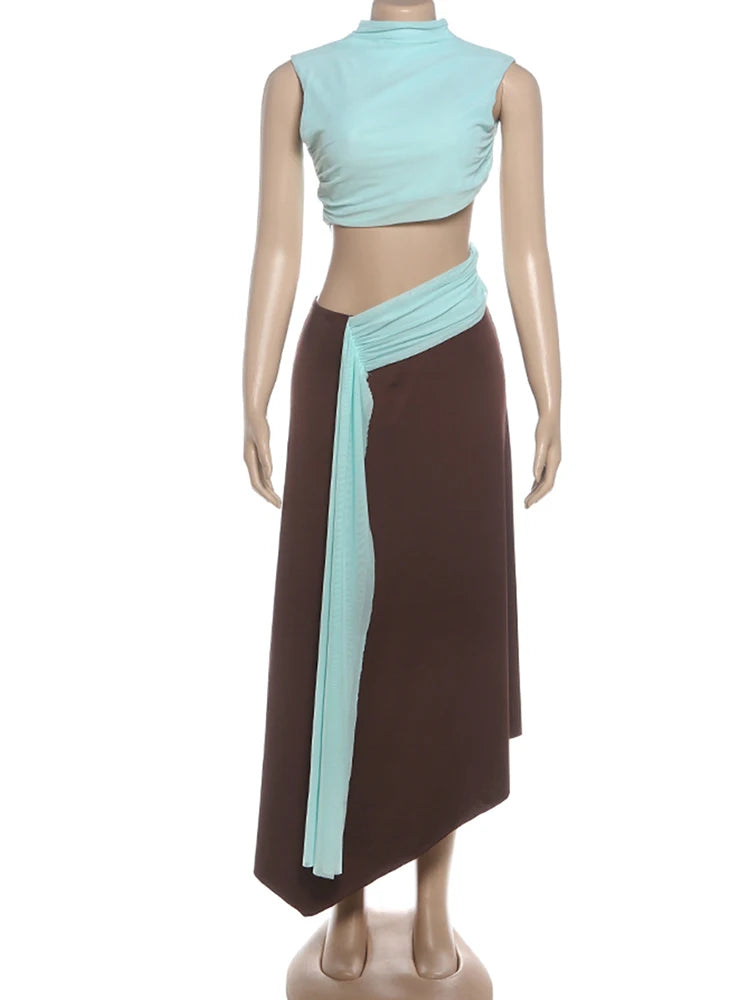 Mannequin wearing a brown and a light blue dress with a ribbon.