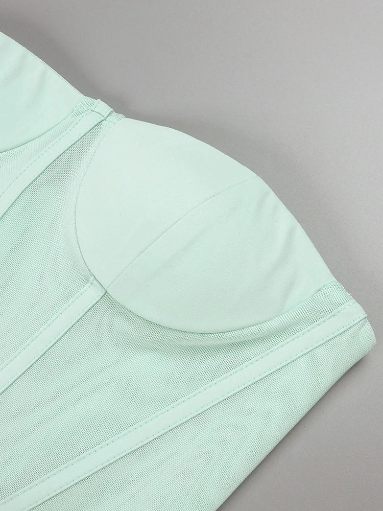 Light green bra on a gray background