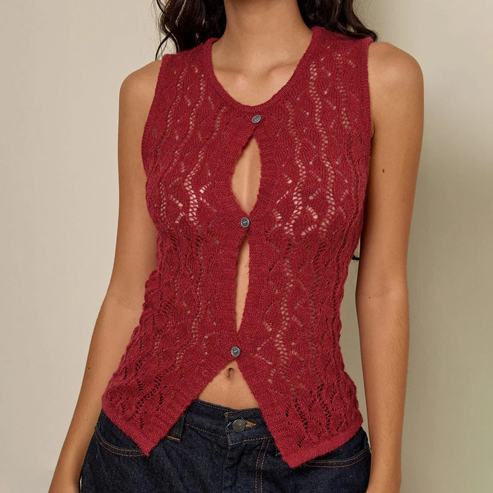 Red knitted vest worn by a person on a beige background