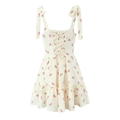 White dress with pink floral pattern on a white background