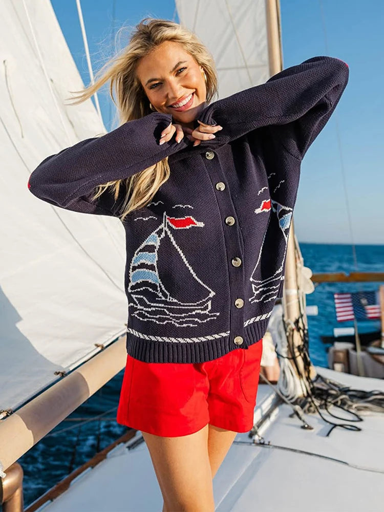 Navy blue intarsia knit coat with sailboat pattern and lapel collar