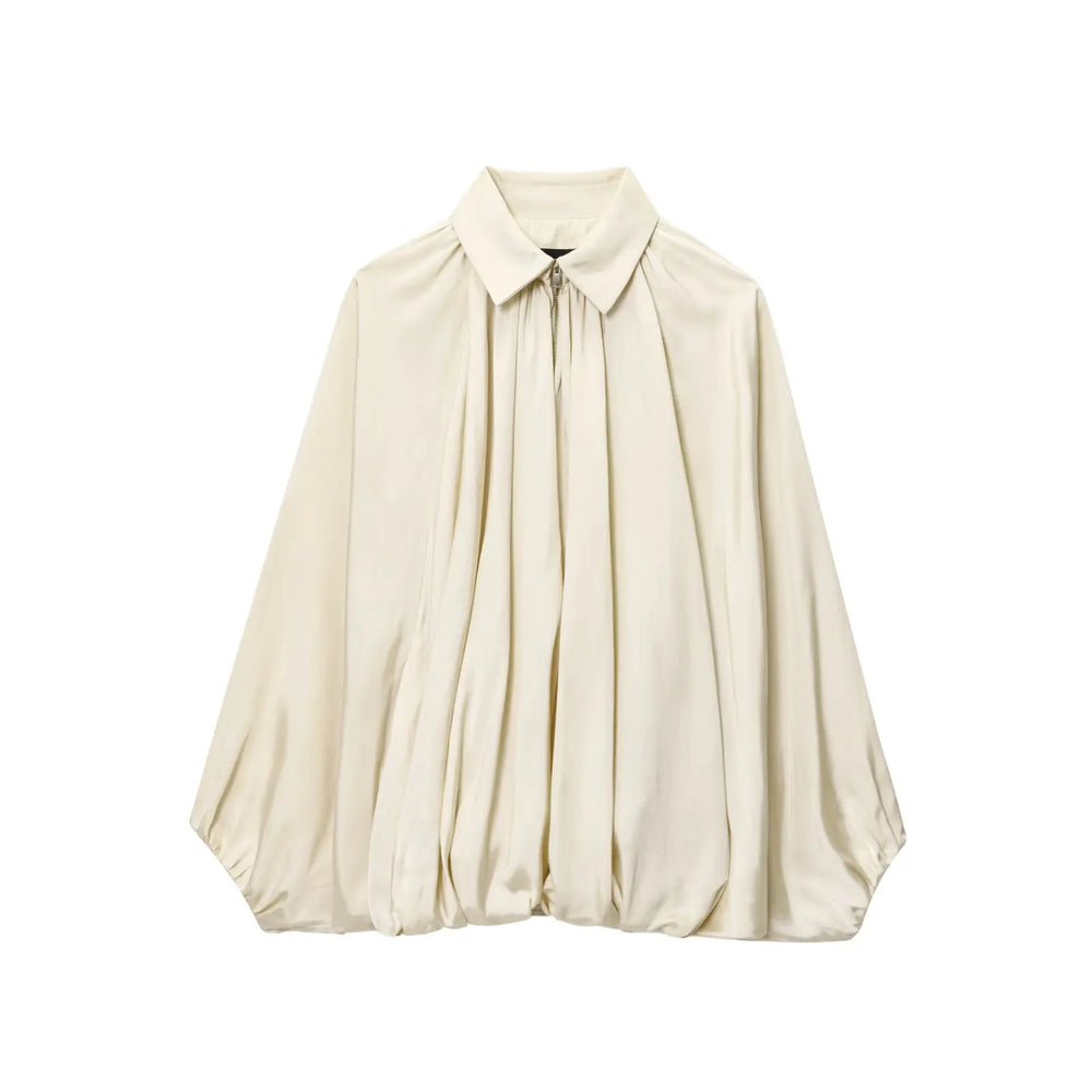 Beige blouse on a white background