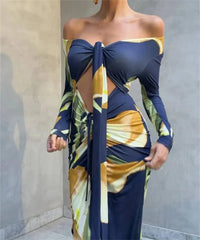 Close-up of the cut-out detail on a floral print off-shoulder maxi dress