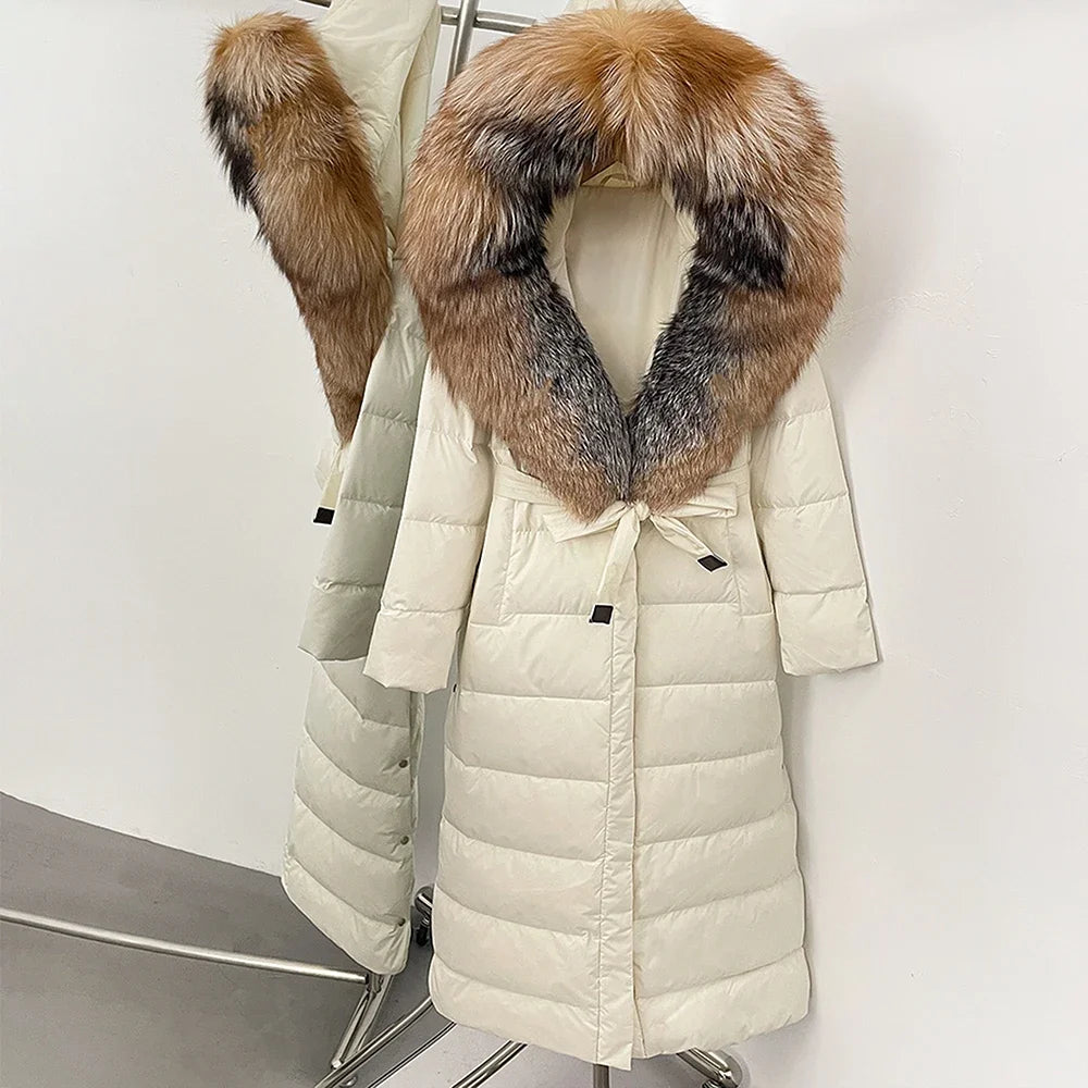 Beige puffer coat with a fur hood on a white background