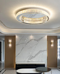 Modern ceiling light fixture in a stylish room with marble wall and wall sconces.