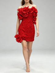 Model walking in a strapless ruffled floral mini dress