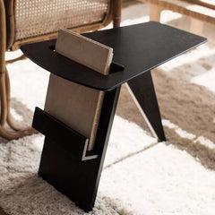 Close-up detail of the sleek lines and minimalist aesthetic of the side table.  Golden Atelier 3