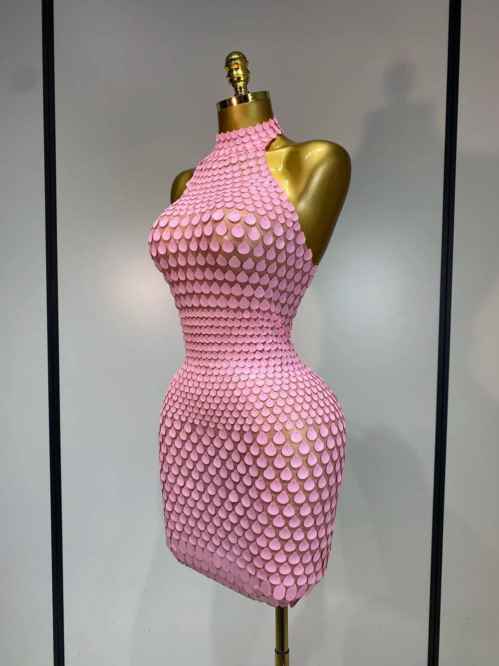 Pink sequin halter mini dress side view