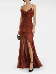 Brown ruched dress with a slit on a white background