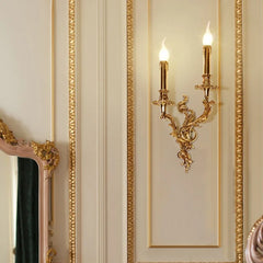 An elegant copper wall lamp with a vintage-inspired design, illuminating a hallway with a warm glow.