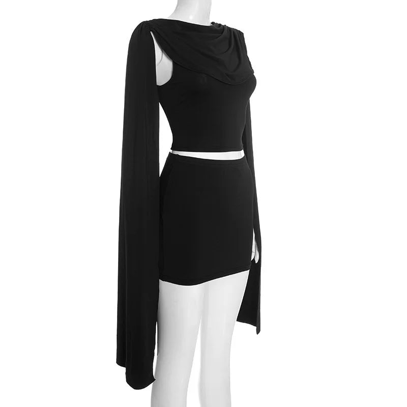 Black dress with cape on a mannequin against a white background