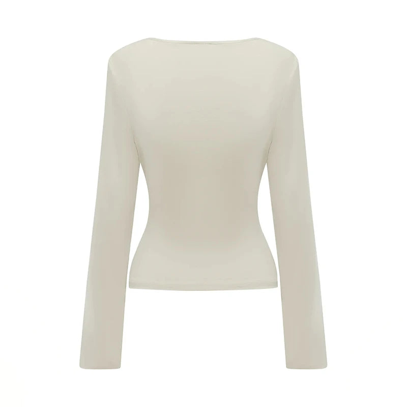 Beige long-sleeve top on a white background