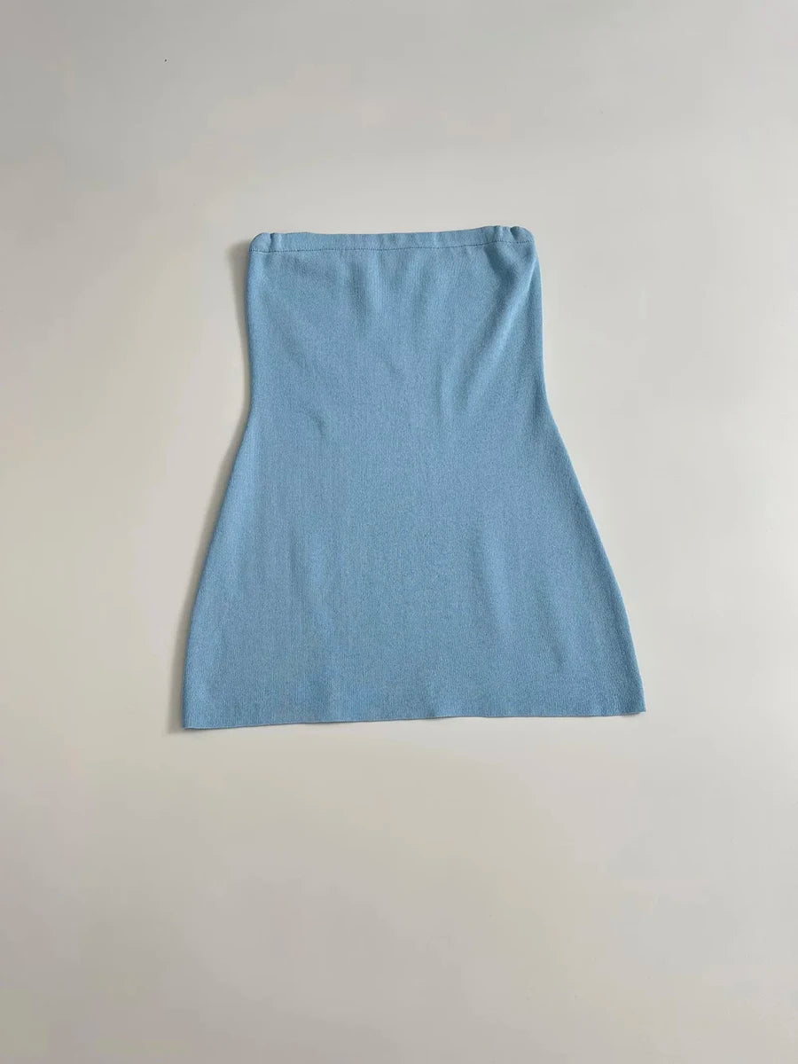 Light blue dress on a light gray background