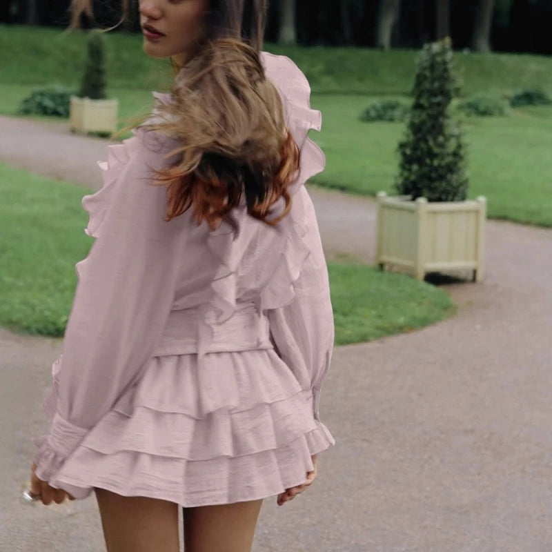 Back view of ruffled tiered mini dress with cinched waist