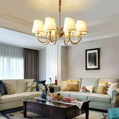 Classic 6-arm cottage chandelier with fabric shades and polished copper frame – warm lighting for dining and living spaces