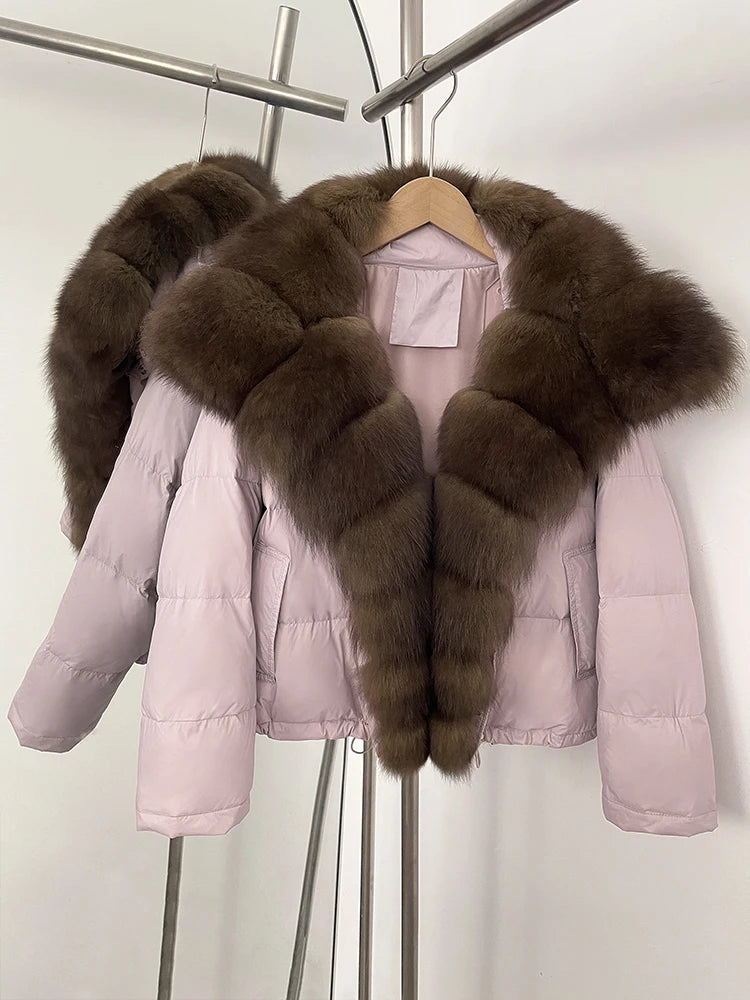 Pink puffer jacket with brown fur collar on a hanger against a white background